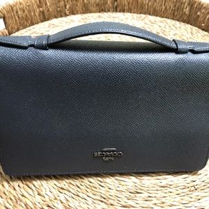 Coach double zip travel organizer wallet with handle.